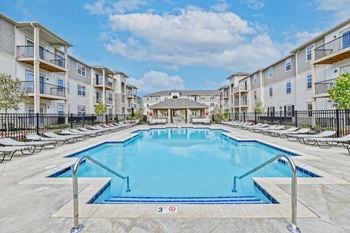 Resort style swimming pool with large sundeck & grill